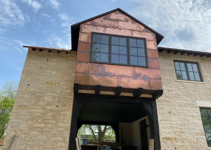 Copper metal panel facade on a stone building for Skylight Installation in Grand Prairie