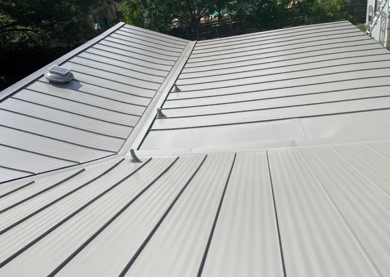 Solar attic fan installed on a metal roof for Roof Ventilation in Grand Prairie